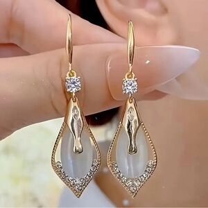 Elegant Gold and Silver Teardrop Earrings.